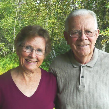 Dr. Robert Bond shares Priest Lake stories with his wife Georgene at their cabin on the end of Coolin Bay.